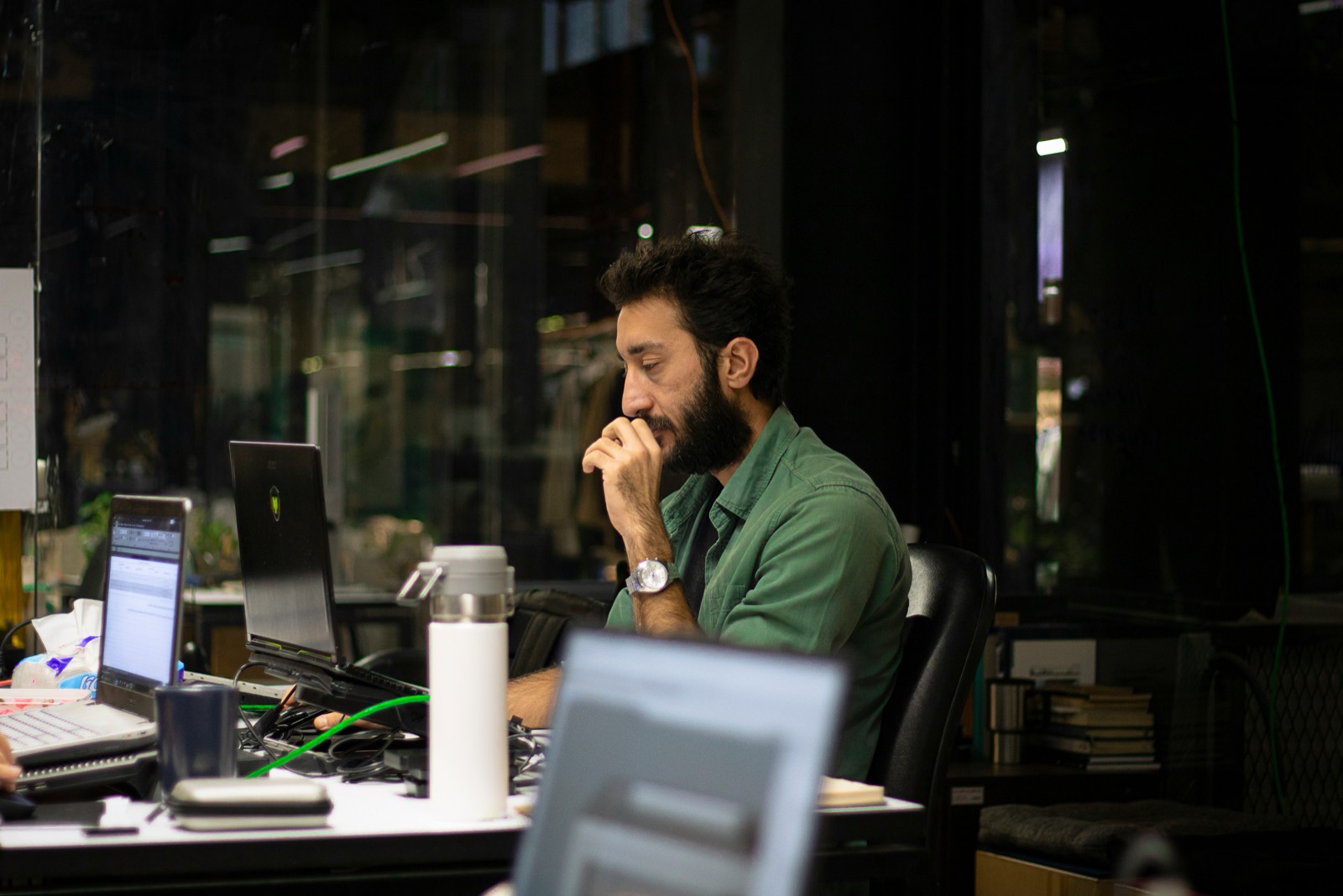 A focused investor analyzing data at a desk